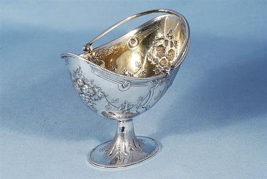 A Victorian silver swing handled sugar basket and sifter spoon, by Martin, Hall & Co, basket height 190mm, weight 7.7oz/241grms.